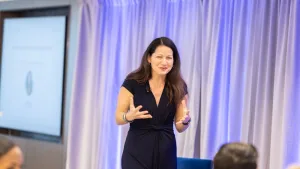 Allison Shapira speaking to a group of leaders during a live executive communication workshop