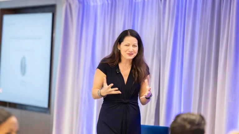 Allison Shapira speaking to a group of leaders during a live executive communication workshop