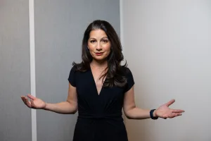 Allison Shapira gesturing openly, illustrating the challenge of finding your voice during moments of uncertainty or creative block