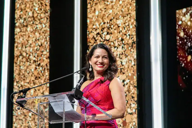 Allison Shapira speaks at a podium after being inducted into the National Speakers Association's CPAE Speaker Hall of Fame at the 2026 annual conference in Austin, Texas.