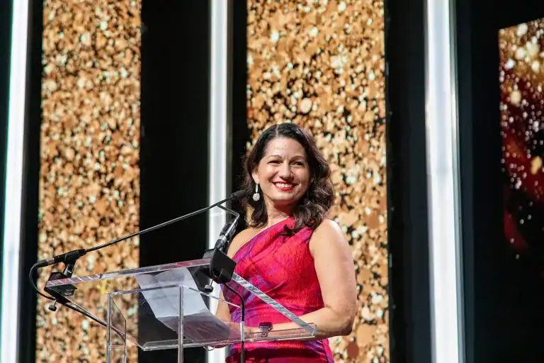 Allison Shapira speaks at a podium after being inducted into the National Speakers Association's CPAE Speaker Hall of Fame at the 2026 annual conference in Austin, Texas.